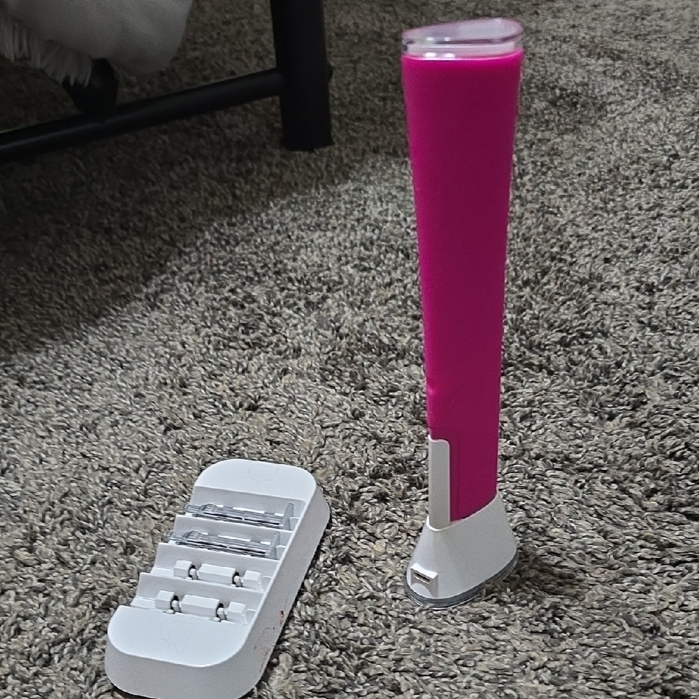 Vibrant Pink and White Skincare Tool with Sleek Design